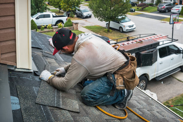 Professional Roof Replacement technician working in Wellsville, PA